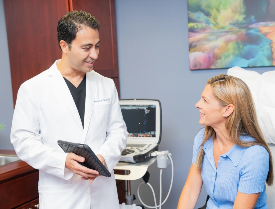 Dr. Kamran Saraf with a patient